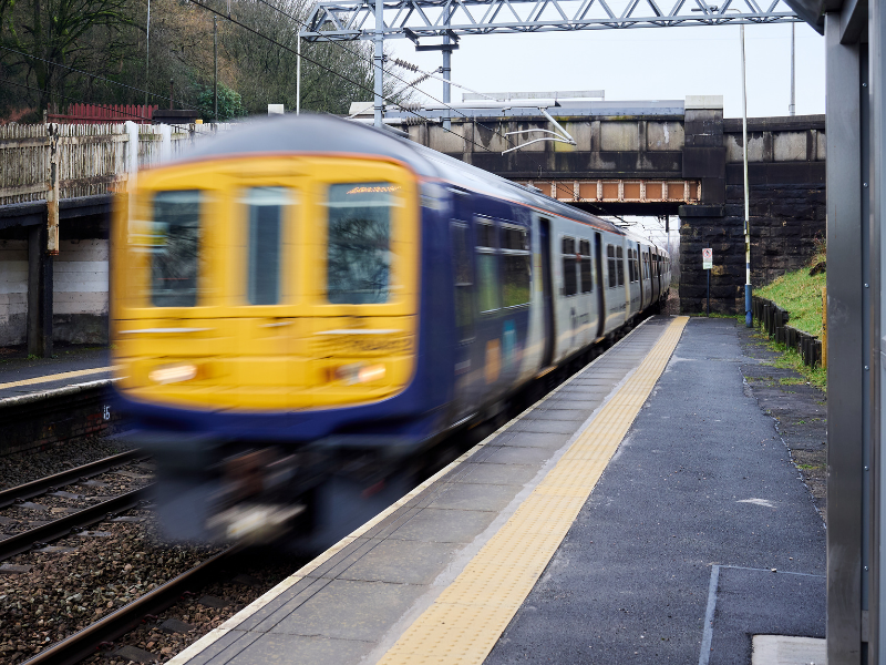 Yellow and Blue train at train station.